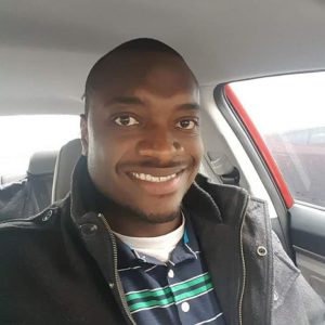 Willie smiling in his car